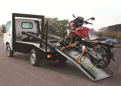 Bike towing van with wheel chock and straps